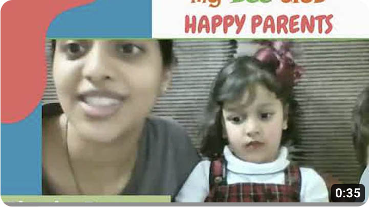 Happy parents with Phonics teaching video for kids learning to read