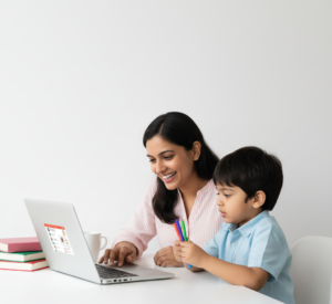 A smiling mother and her young son learning together on a laptop during an online English class